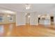 Open-concept living space with hardwood floors, recessed lighting, and seamless flow to other rooms at 7000 Millstone Ridge Ct, Raleigh, NC 27614