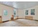 Enclosed patio featuring a concrete floor, neutral paint, and three large windows at 7000 Millstone Ridge Ct, Raleigh, NC 27614