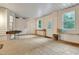 Enclosed patio featuring a concrete floor, neutral paint, and three large windows at 7000 Millstone Ridge Ct, Raleigh, NC 27614