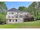 Well-maintained home with walkout basement and a large deck, showcasing outdoor living at 7000 Millstone Ridge Ct, Raleigh, NC 27614
