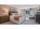 Comfortable main bedroom with large window, stylish decor, and bedside tables with lamps at 701 Holstein Dairy Way, Wake Forest, NC 27587