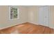 Bright bedroom with hardwood floors, a window, neutral paint, and a closet at 702 Wedgewood Ave, Zebulon, NC 27597