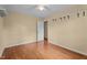 Spacious bedroom with hardwood floors, overhead fan, neutral walls and two windows at 702 Wedgewood Ave, Zebulon, NC 27597