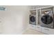 Convenient laundry room with side-by-side washer and dryer units with built-in storage at 702 Wedgewood Ave, Zebulon, NC 27597