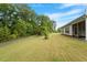 View of a large backyard and property from the back of the home, showing the home's layout and yard space at 704 Long Lake Dr, Fuquay Varina, NC 27526