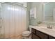 Bathroom featuring a shower/tub with curtain, toilet, and vanity at 704 Long Lake Dr, Fuquay Varina, NC 27526
