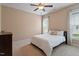 Neutral bedroom featuring a queen bed, carpet flooring, and lots of light at 704 Long Lake Dr, Fuquay Varina, NC 27526