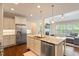 Gourmet kitchen featuring stainless steel appliances and a center island with seating at 704 Long Lake Dr, Fuquay Varina, NC 27526