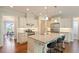 Well-equipped kitchen with a large island, stainless steel appliances, and modern lighting at 704 Long Lake Dr, Fuquay Varina, NC 27526