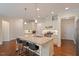 Open kitchen featuring a large island with seating and stainless steel appliances at 704 Long Lake Dr, Fuquay Varina, NC 27526