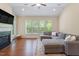 Inviting living room with natural light, hardwood floors, and comfortable seating at 704 Long Lake Dr, Fuquay Varina, NC 27526