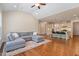 Open concept living room with adjacent kitchen and vaulted ceilings at 704 Long Lake Dr, Fuquay Varina, NC 27526