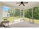 Screened-in porch featuring an outdoor living area with seating and views of the backyard at 704 Long Lake Dr, Fuquay Varina, NC 27526