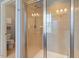 Shower featuring tile surround, glass door, rainfall shower head and built in seating at 704 Long Lake Dr, Fuquay Varina, NC 27526