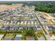Aerial view of new home community with lush green landscaping and community pool at 712 Emmer St, Rolesville, NC 27571