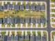 Aerial view of new home community featuring neat lawns, sidewalks and parallel street parking at 712 Emmer St, Rolesville, NC 27571
