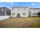 Large grassy backyard features sliding glass doors, perfect for easy indoor outdoor living at 712 Emmer St, Rolesville, NC 27571