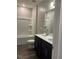 Modern bathroom featuring a dual sink vanity, toilet, and combination tub/shower at 712 Emmer St, Rolesville, NC 27571