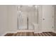 Elegant bathroom featuring a glass-enclosed shower with marble-style tiling and a built-in bench at 712 Emmer St, Rolesville, NC 27571