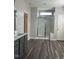 Bathroom featuring a dual sink vanity with gray cabinets and a walk-in shower with a bench at 712 Emmer St, Rolesville, NC 27571