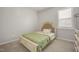 Cozy bedroom featuring a comfortable bed with floral patterned bedding and a bright, sunlit window at 712 Emmer St, Rolesville, NC 27571