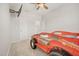 This bedroom offers a playful car-shaped bed, wall-mounted TV, and modern ceiling fan at 712 Emmer St, Rolesville, NC 27571