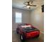 Fun bedroom with car-shaped bed and ceiling fan at 712 Emmer St, Rolesville, NC 27571