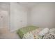 Comfortable carpeted bedroom showcasing a double-door closet and charming star-patterned ceiling at 712 Emmer St, Rolesville, NC 27571