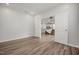 Flex room with hardwood floors and white doors leading into the kitchen and living room at 712 Emmer St, Rolesville, NC 27571