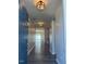Inviting entryway with hardwood floors and modern lighting fixtures throughout the hallway at 712 Emmer St, Rolesville, NC 27571