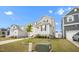 Well-maintained home with gray siding, a brick-lined staircase, green lawn, and manicured landscaping at 712 Emmer St, Rolesville, NC 27571