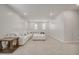 Cozy living room with carpet, recessed lighting, and large couch at 712 Emmer St, Rolesville, NC 27571