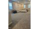 Spacious living room featuring neutral colors and a comfortable sectional sofa at 712 Emmer St, Rolesville, NC 27571