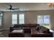 Spacious living room featuring a large sectional couch, hardwood floors, and ample natural light at 712 Emmer St, Rolesville, NC 27571