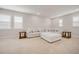 Bright living room with carpet, recessed lighting, large couch and lots of natural light at 712 Emmer St, Rolesville, NC 27571