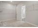 Spacious walk-in closet features neutral carpet and shelving perfect for organizing clothing and accessories at 712 Emmer St, Rolesville, NC 27571