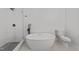 Bathroom featuring a stand alone soaking tub, frameless shower, and tile flooring at 7204 Laketree Dr, Raleigh, NC 27615