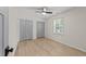 Neutral bedroom showcasing natural light and spacious closet storage at 7204 Laketree Dr, Raleigh, NC 27615
