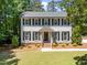 Classic two-story home showcasing well-placed landscaping, and traditional curb appeal at 7204 Laketree Dr, Raleigh, NC 27615