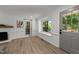 Bright open living space with wide windows, gray door and plenty of natural light at 7204 Laketree Dr, Raleigh, NC 27615