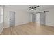 Large bedroom with hardwood floors, and an ensuite bathroom with barn door at 7204 Laketree Dr, Raleigh, NC 27615
