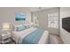 Bright bedroom with neutral walls, plush carpet, and a bed with stylish headboard and decorative pillows at 7340 Doverton Ct, Raleigh, NC 27615