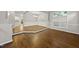 Open concept dining area with hardwood floors, white trim, and abundant natural light at 7340 Doverton Ct, Raleigh, NC 27615