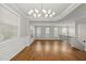 Open concept dining area offers hardwood floors, elegant lighting, and abundant natural light at 7340 Doverton Ct, Raleigh, NC 27615