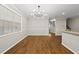 Bright dining room features hardwood floors, neutral paint, and a modern chandelier at 7340 Doverton Ct, Raleigh, NC 27615