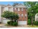 Charming brick townhouse with well-maintained landscaping and a two-car garage at 7340 Doverton Ct, Raleigh, NC 27615