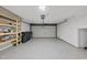Clean and spacious garage with shelving and epoxy flooring for a modern look at 7340 Doverton Ct, Raleigh, NC 27615
