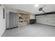 Spacious garage with epoxy floors, shelving, lockers, and an automatic door opener at 7340 Doverton Ct, Raleigh, NC 27615