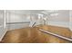 Open concept living area boasts beautiful hardwood floors, neutral paint, and elegant lighting at 7340 Doverton Ct, Raleigh, NC 27615