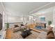 Staged open concept living area featuring beautiful hardwood floors and neutral paint palette at 7340 Doverton Ct, Raleigh, NC 27615